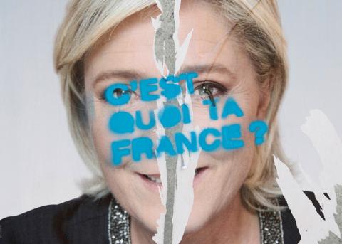 Marine Le Pen auf einem zerstörten Wahlplakat in Paris